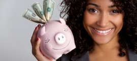 pretty-black-woman-holding-piggy-bank